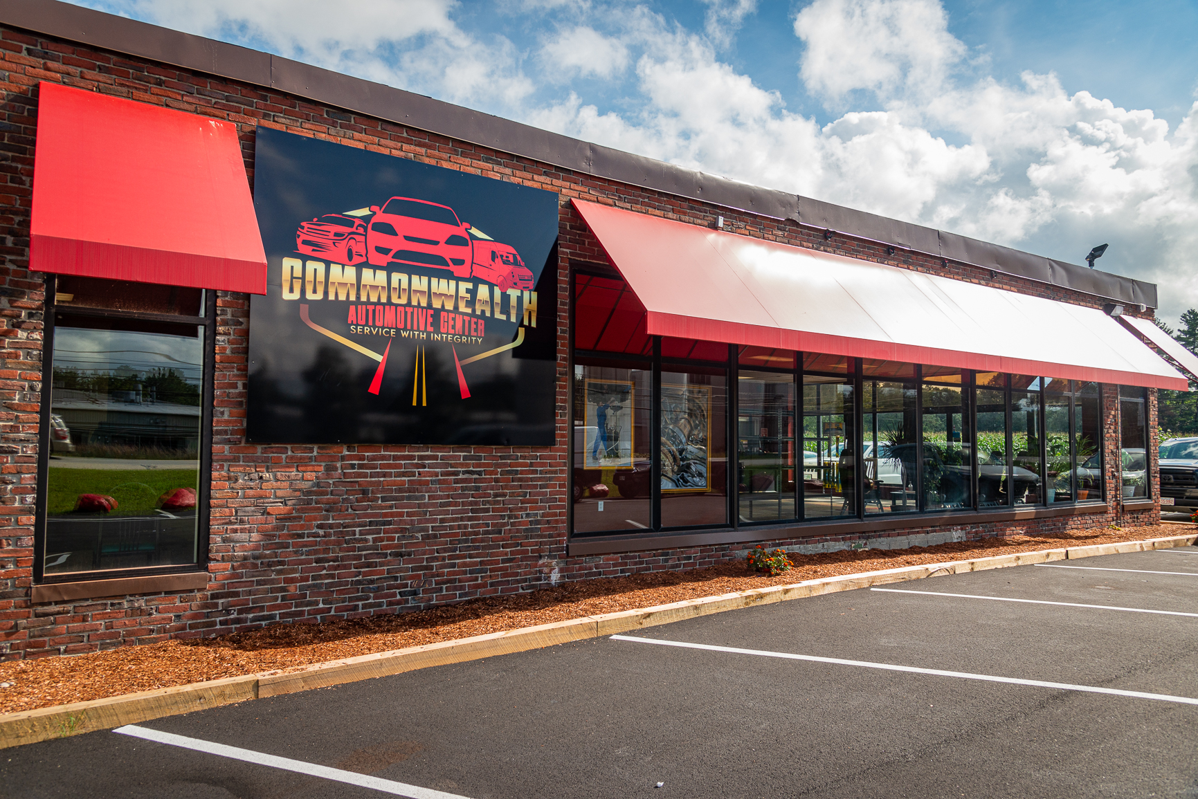 Commonwealth Automotive Center storefront with red awnings
