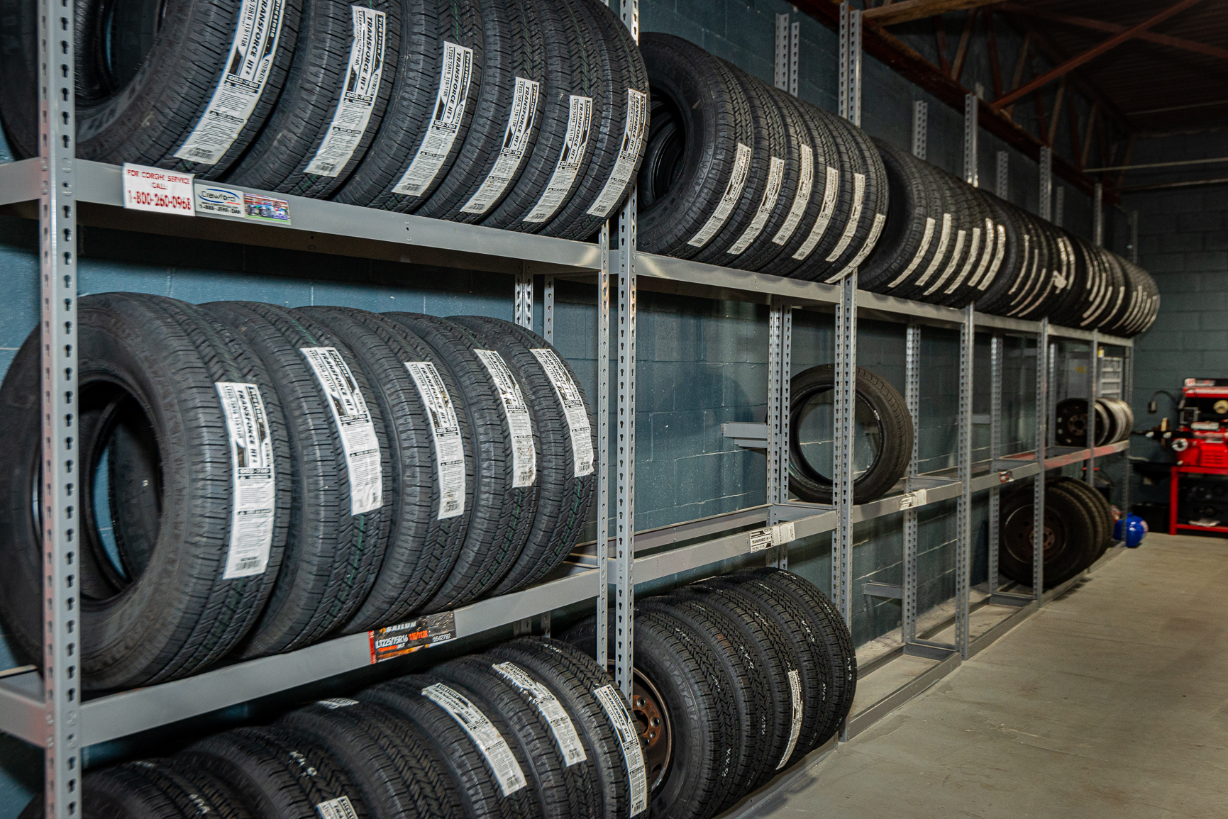 Racks of new tires stocked in the shop